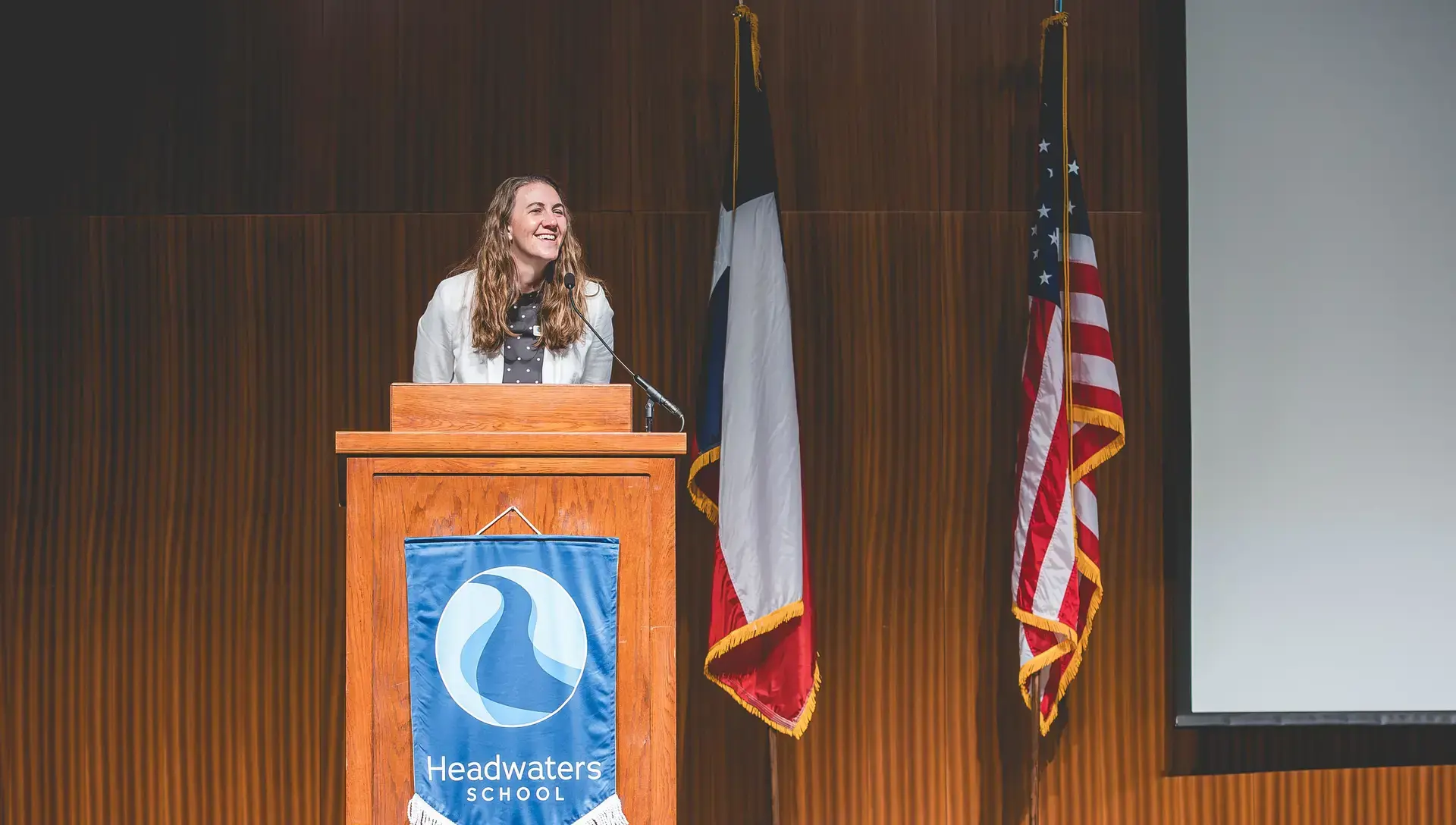 Stephanie addressing the audience during headwaters school commencement