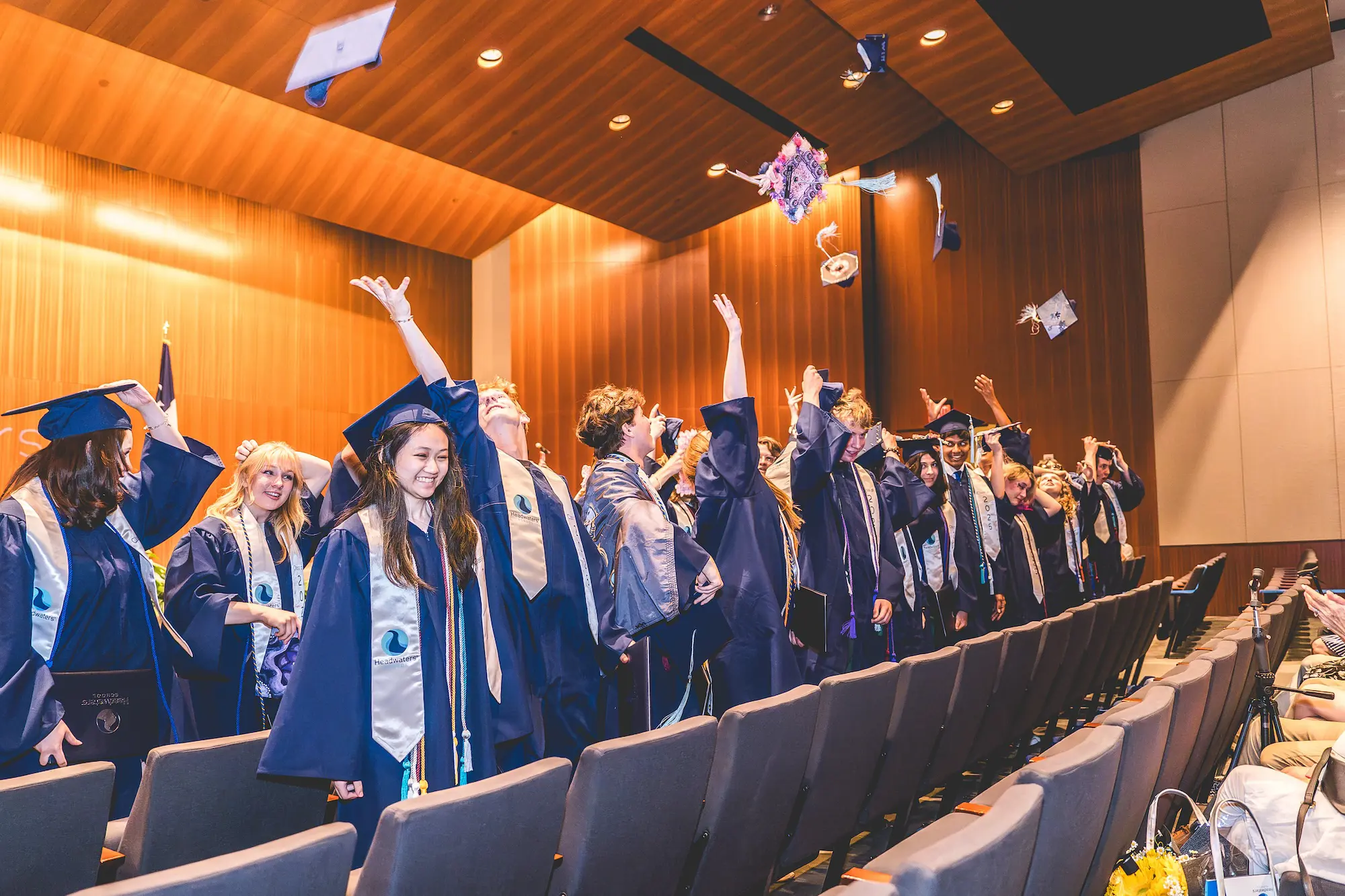 The Class of 2025 toss their caps to close out commencement and celebrate graduating.