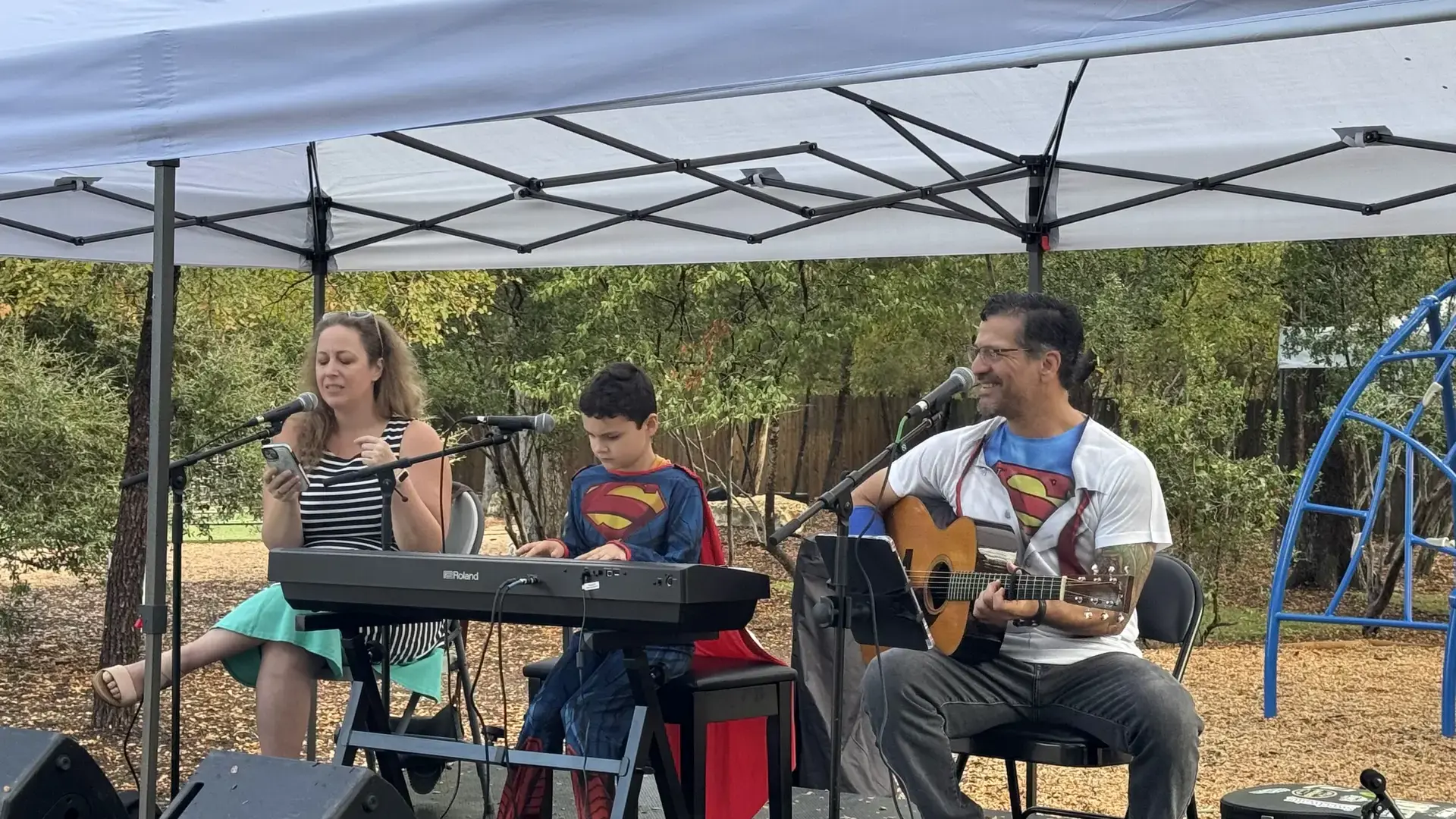 musicians performing on stage with keyboard and guitar during the Headwaters Fall Fest.