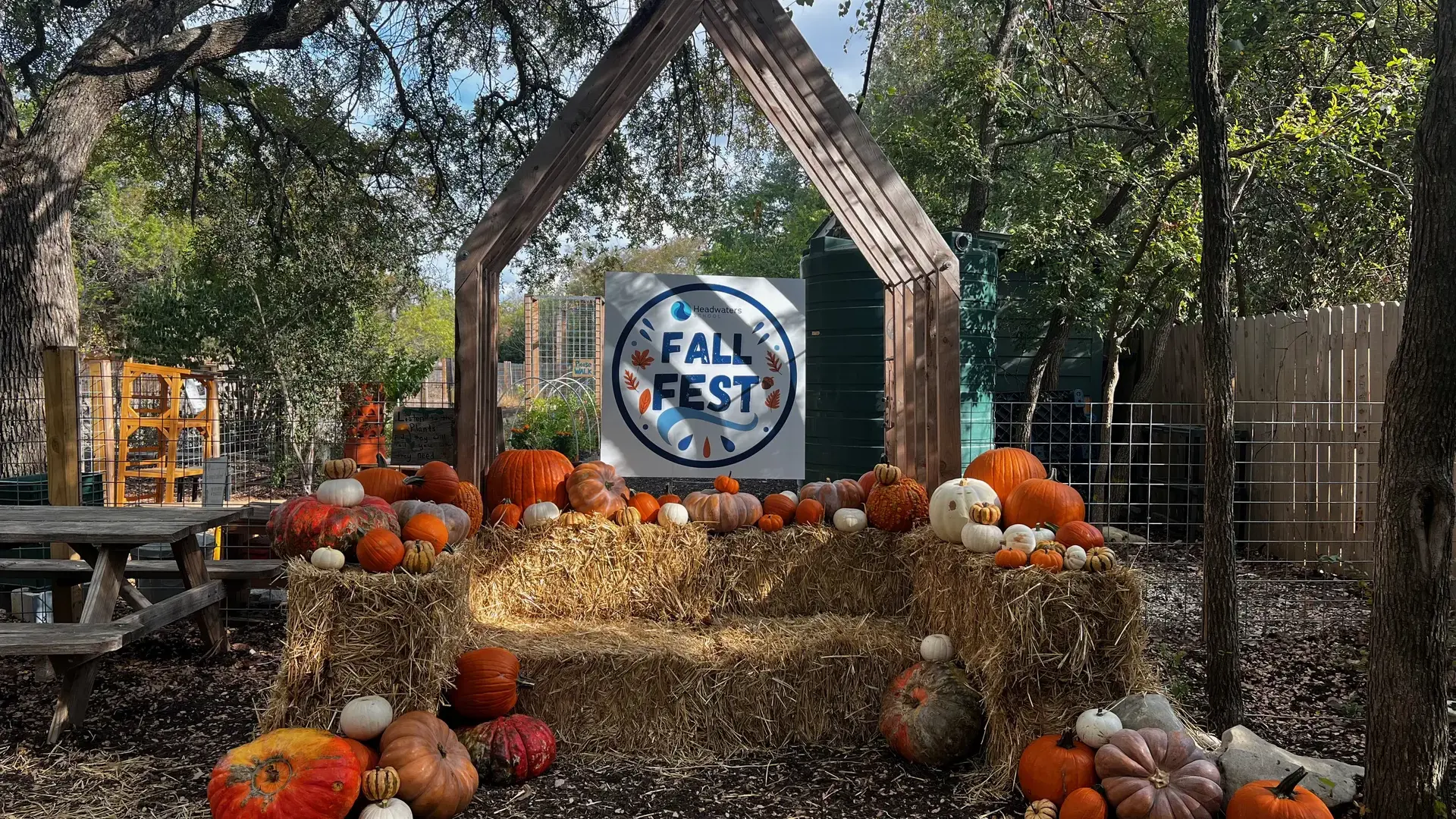 pumpkin display with hay bales set up outdoors for the Headwaters Fall Fest.