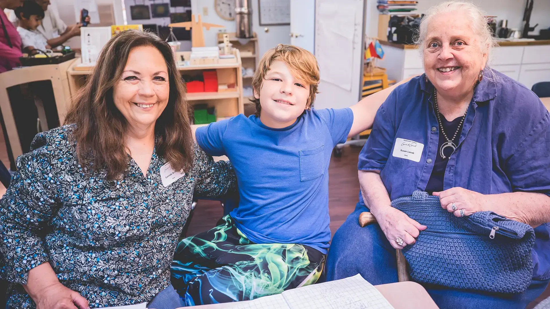 elementary student posing together with family members during Grandparents and Special Friends Day.