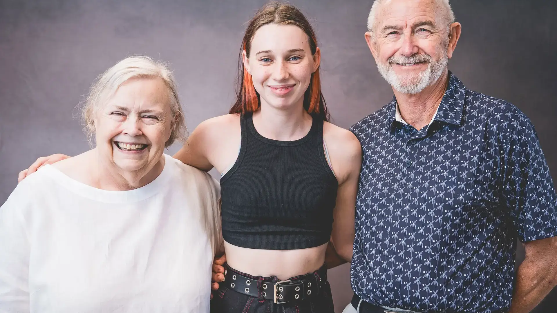 student posing together with grandparents during Grandparents and Special Friends Day.