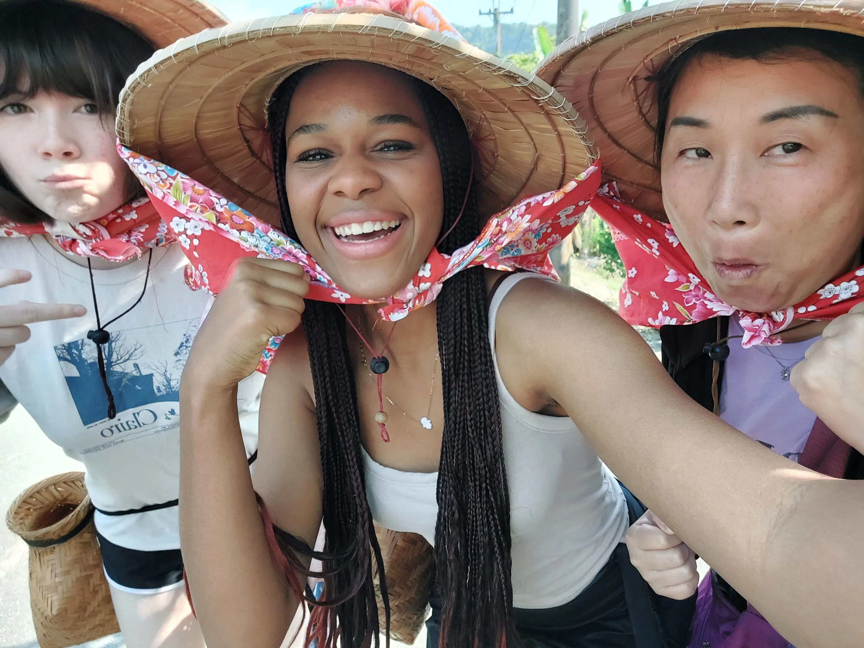 High school student in the center smiling on a trip to Vietnam.