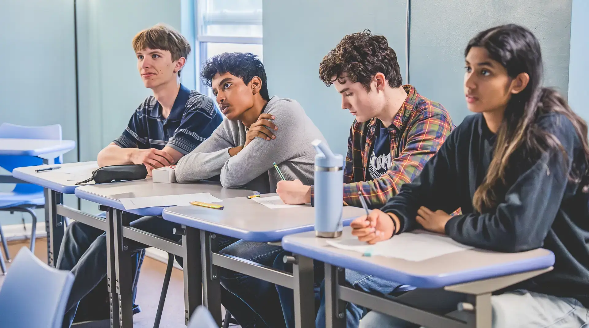 IB Students listen carefully to an IB Math Lesson.