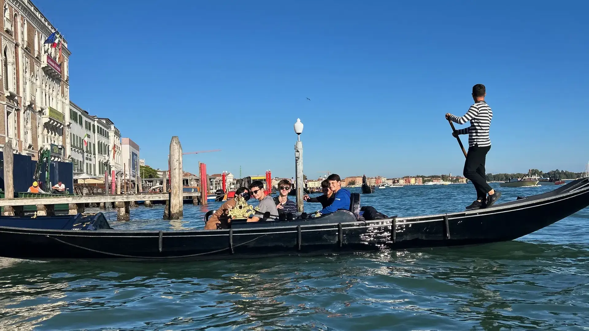 students riding a gondola along a canal during an international travel program