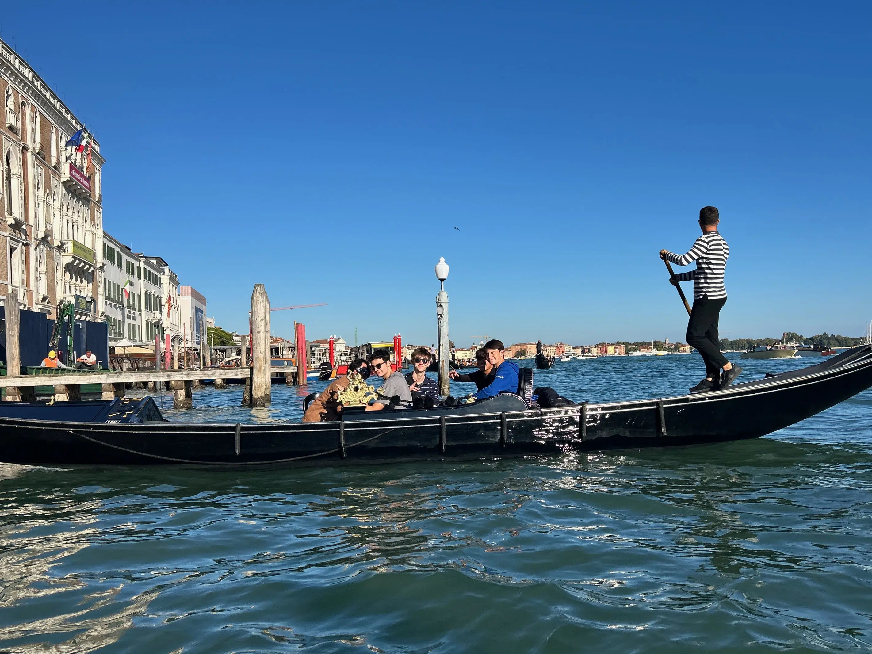 students riding a gondola along a canal during an international travel program.