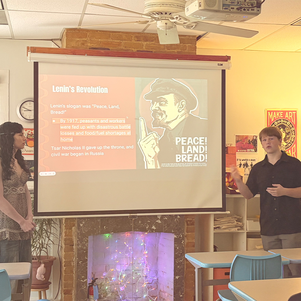 High school seniors present a lesson on Russia to tie in with the Russian literature that 8th graders were learning.