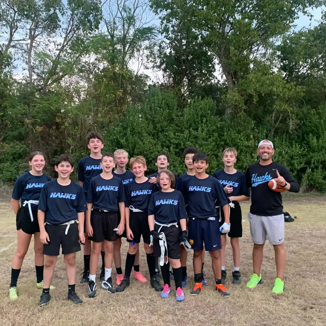 Middle school flag football team poses for a group photo.