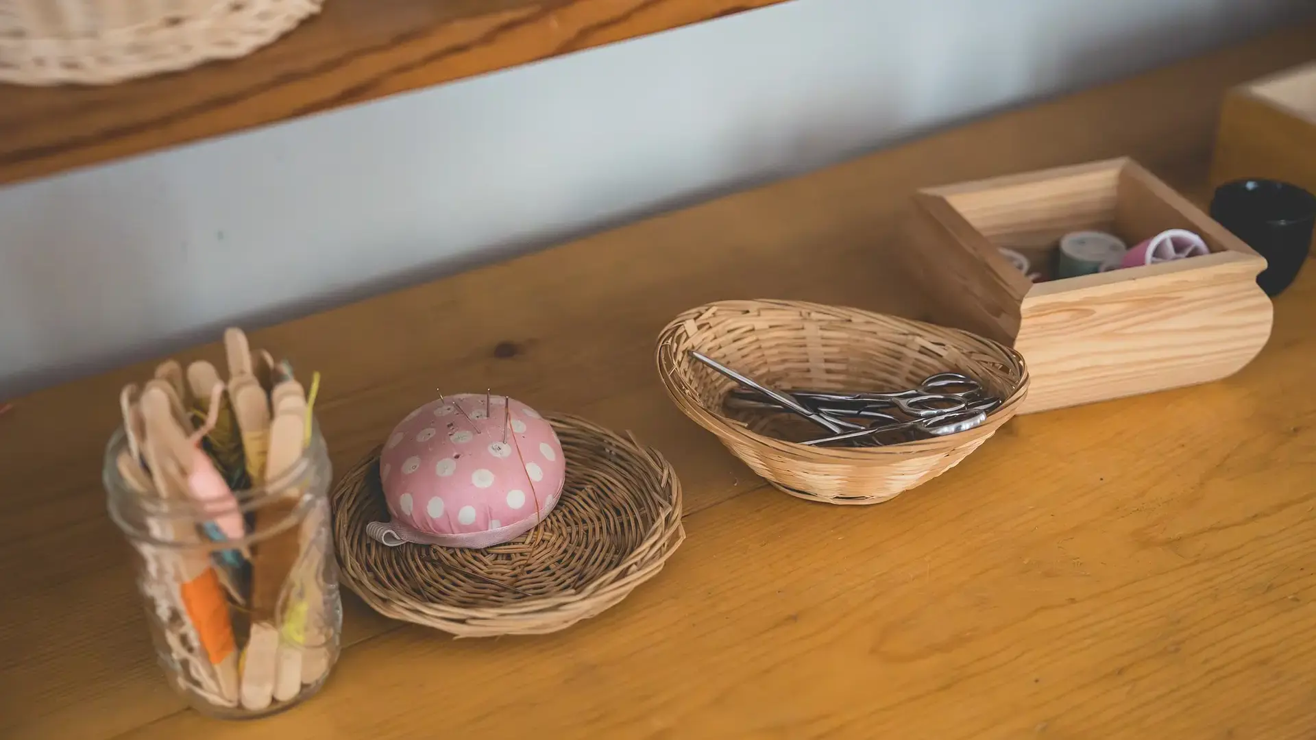 Primary classroom table with baskets and materials for a practical life activity.